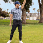 Man celebrating golf shot wearing Black Clover Live Lucky premium clover hat in blue.